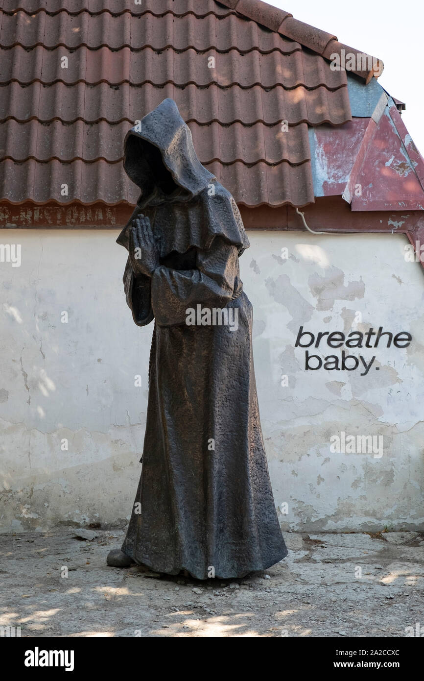 Dark Ghost Monk Statue by Paul Mand in the Danish King Garden (Taani Kuninga)Tallinn, Estonia Stock Photo