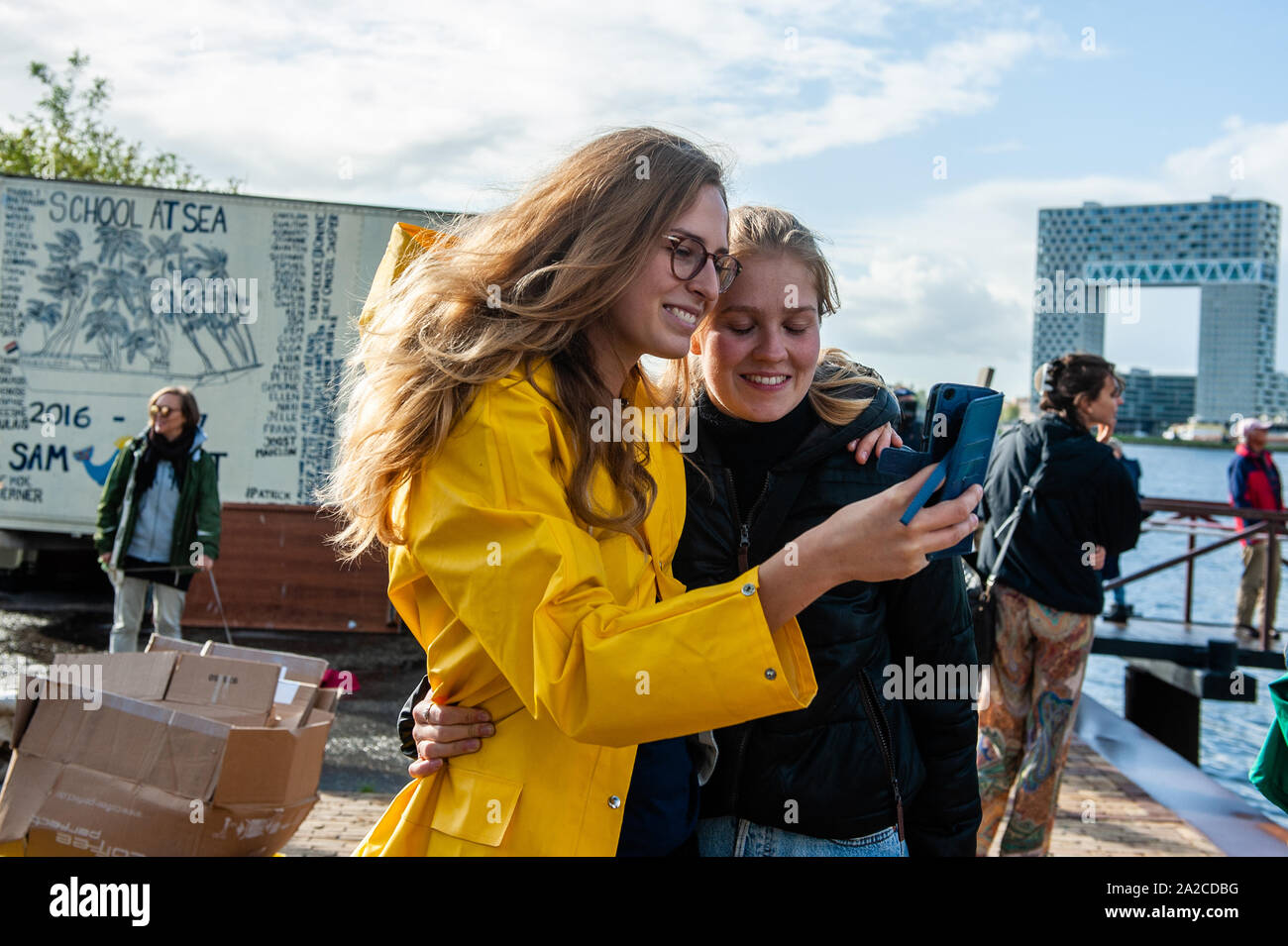 Amsterdam, The Netherlands. 02nd Oct, 2019. A climate activist is seen talking with a friend before departing.From the NDSM Wharf in Amsterdam, 36 climate activists are sailing out to go to the UN Climate Conference in Santiago, Chile. Between them, there is Anuna de Weber, who is the organizer of the Climate Strikes in Belgium and Adélaïde Charlier, French-speaking coordinator for the 'Youth for climate' movement. Credit: SOPA Images Limited/Alamy Live News Stock Photo