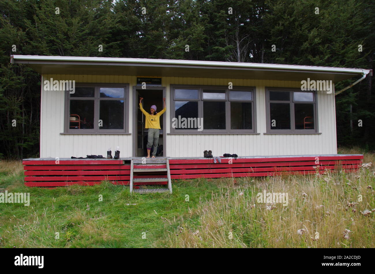 Thai female backpacker at Kiwi burn hut. Te Araroa Trail. South Island