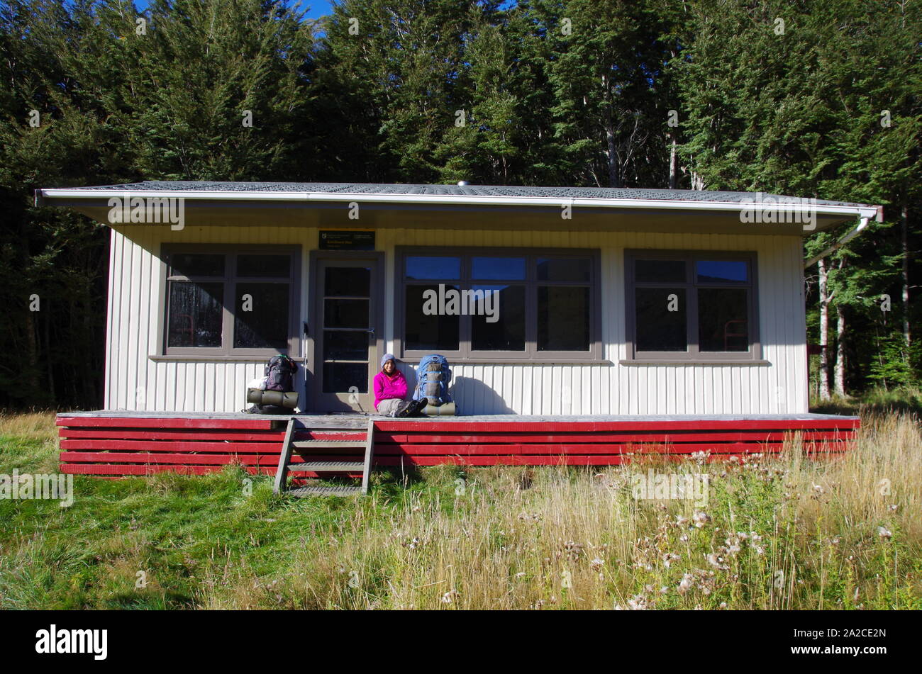Thai female backpacker at Kiwi burn hut. Te Araroa Trail. South Island