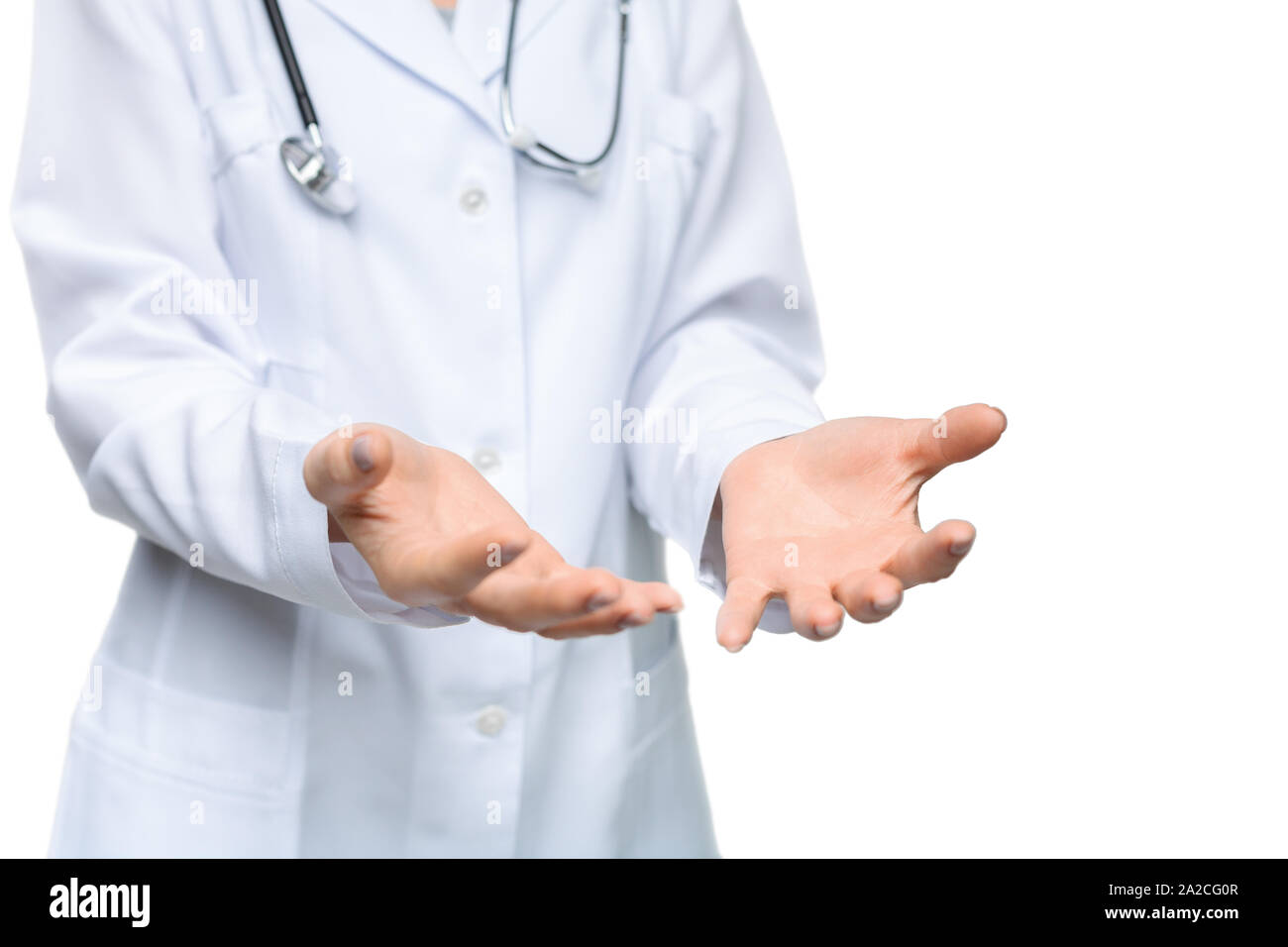 Female doctor standing with outstretched hands and open palms Stock Photo