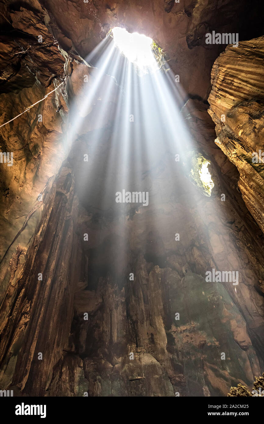Shaft of light entering Niah cave, Malaysia Stock Photo