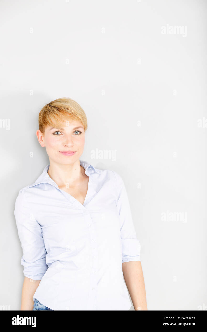 Female in blue shirt hi-res stock photography and images - Alamy