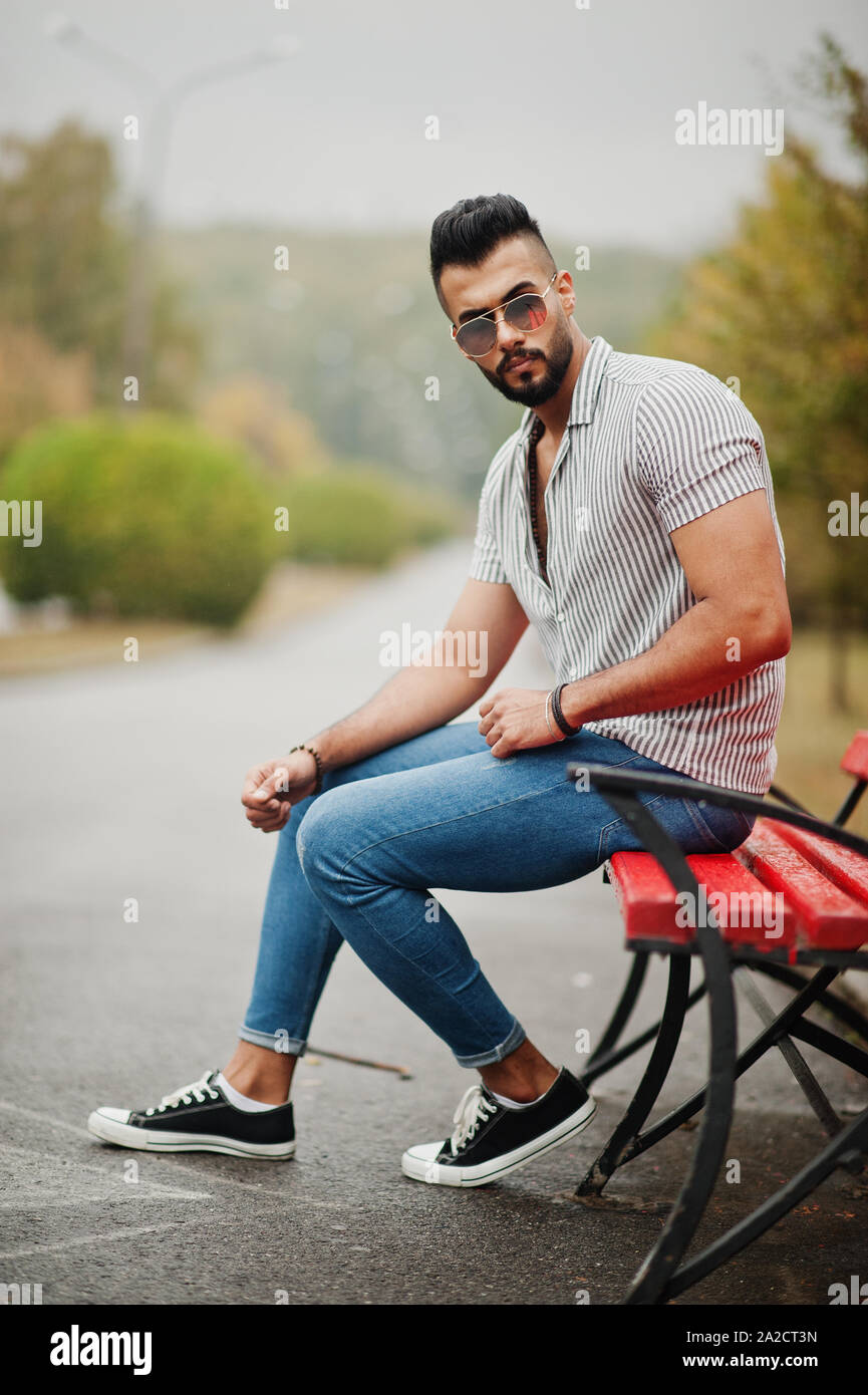 Arab man sitting on park bench hi-res stock photography and images - Alamy