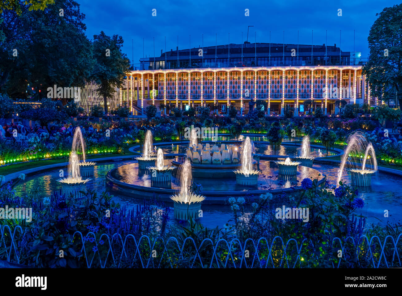 The Tivoli Gardens Concert Hall and fountains illuminated at night in Copenhagen, Denmark. Stock Photo