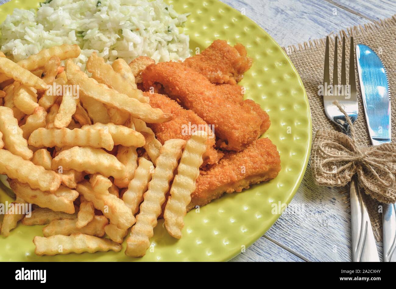 Tasty hot dinner. Quick dinner to prepare on a wooden table. Stock Photo