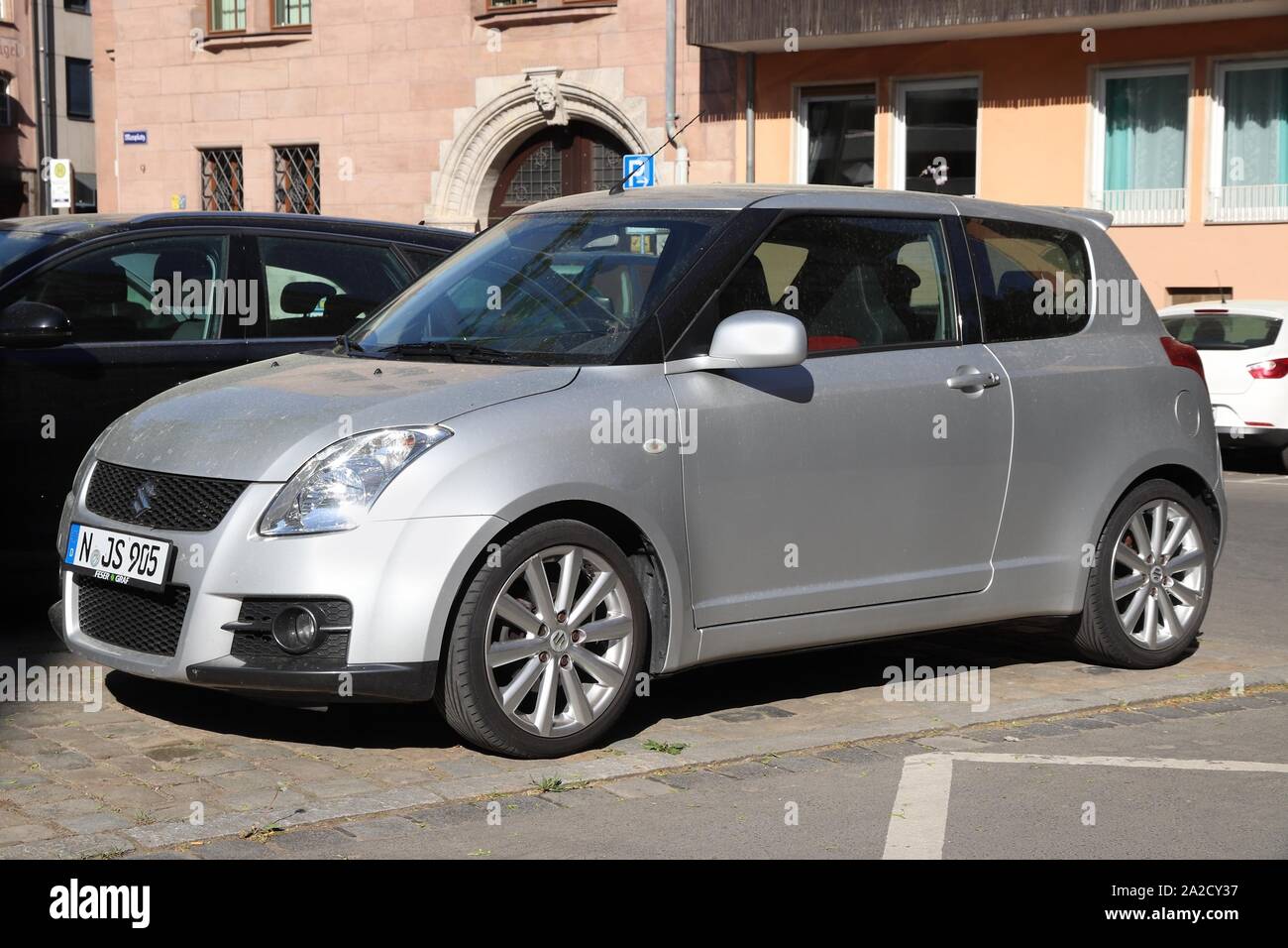 NUREMBERG, GERMANY - MAY 6, 2018: Silver Suzuki Swift compact hatchback car parked in Germany. There were 45.8 million cars registered in Germany (as Stock Photo