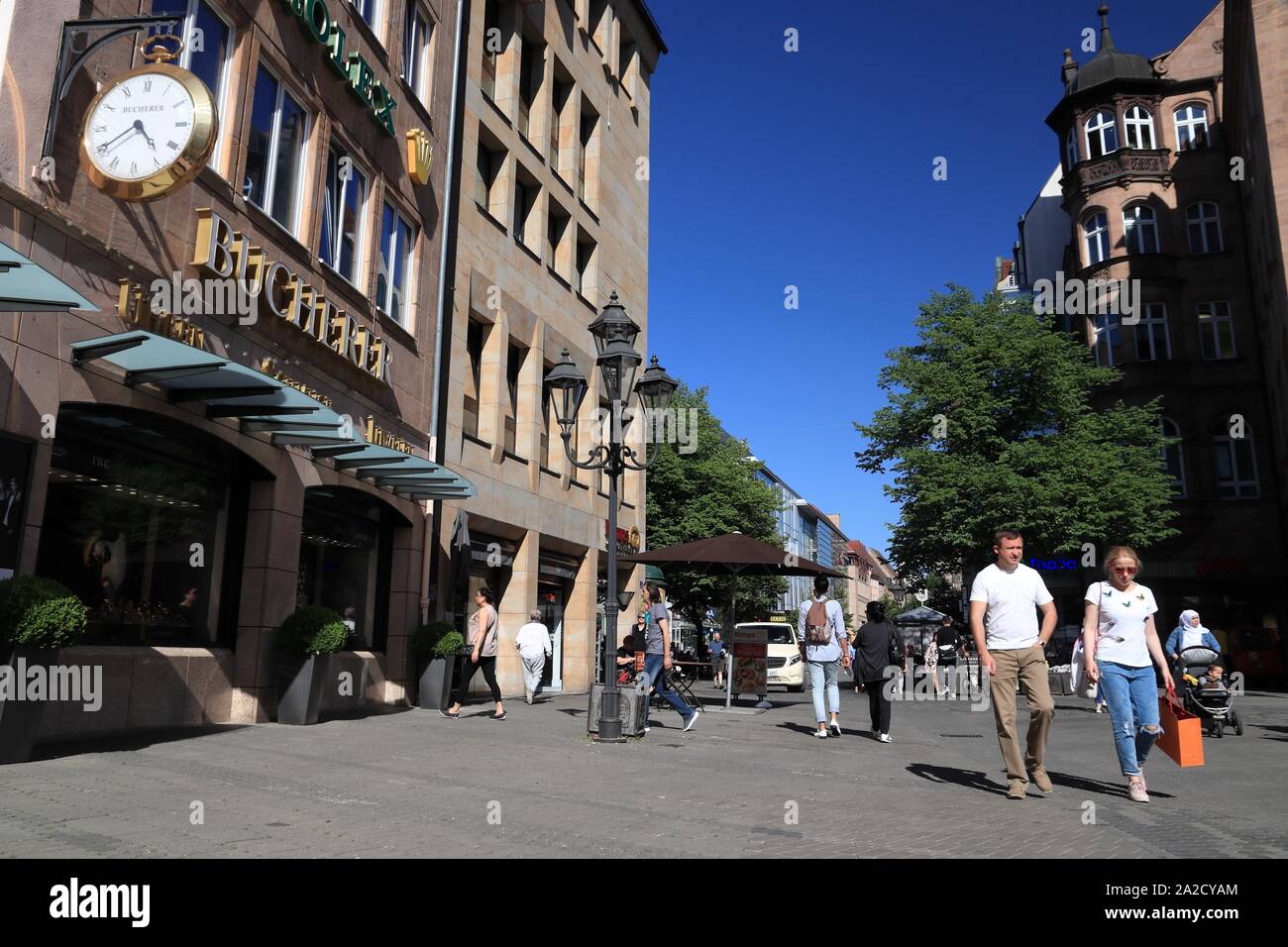 NUREMBERG, GERMANY - MAY 7, 2018: People visit Hefnersplatz (Hefner Square) shopping area in Nuremberg Old Town, Germany. Stock Photo