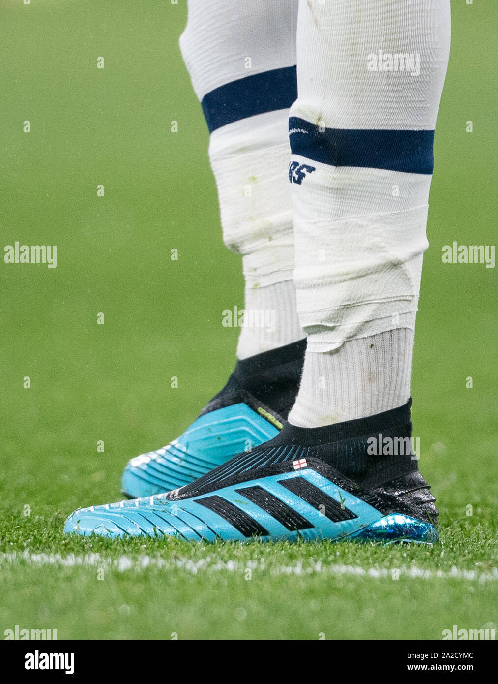 The Adidas football boots of Dele Alli of Spurs with England flag during  the UEFA Champions League group match between Tottenham Hotspur and Bayern  Munich at Wembley Stadium, London, England on 1