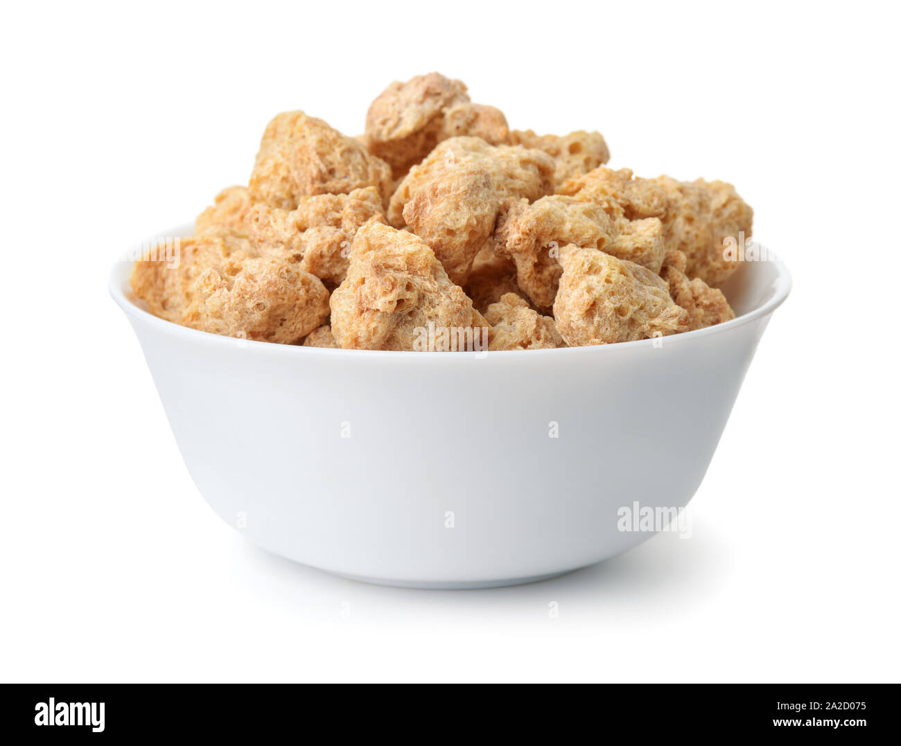 Bowl of dry soya chunks isolated on white Stock Photo