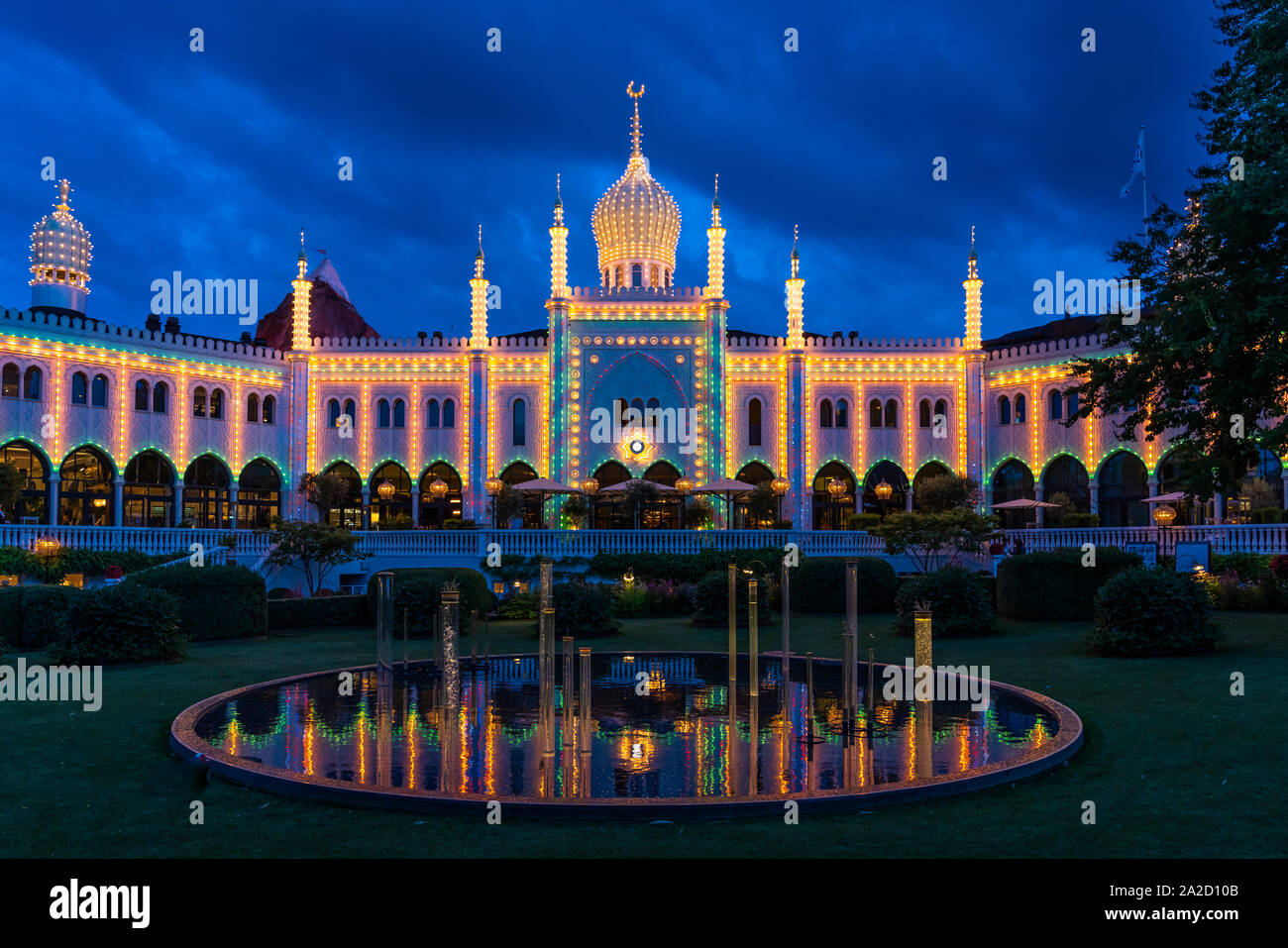 The Moorish Palace, the Nimb Hotel and Restaurant illuminated at night in the Tivoli Gardens, Copenhagen, Denmark. Stock Photo