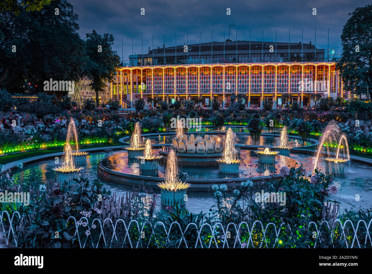 The Tivoli Gardens Concert Hall and fountains illuminated at night in Copenhagen, Denmark. Stock Photo