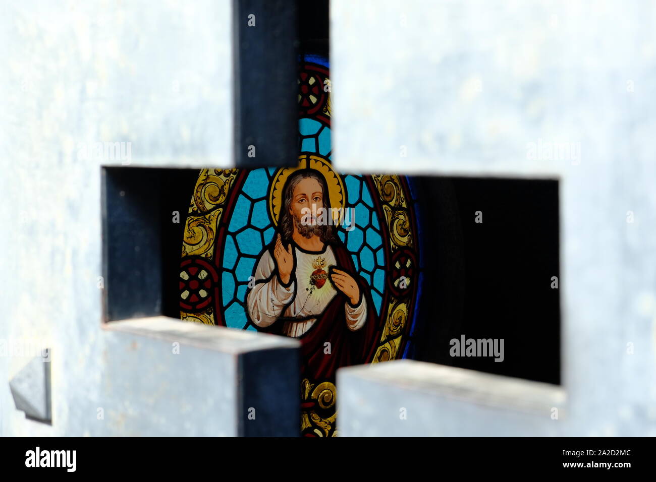 Argentina Buenos Aires Jesus Christus stained glass window framed by a cross Stock Photo