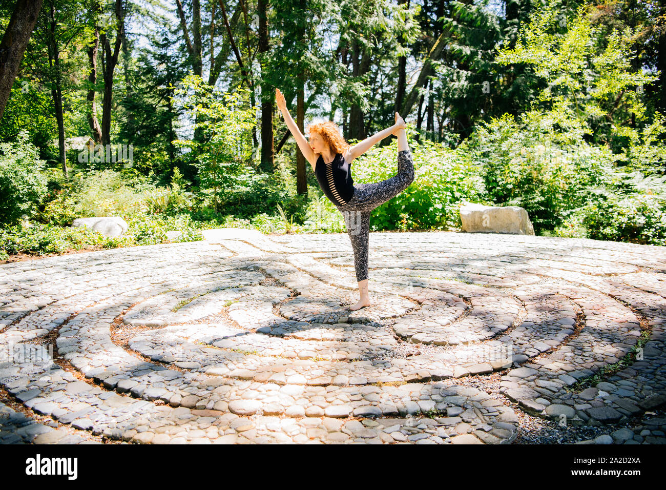 Doing standing yoga hires stock photography and images Alamy