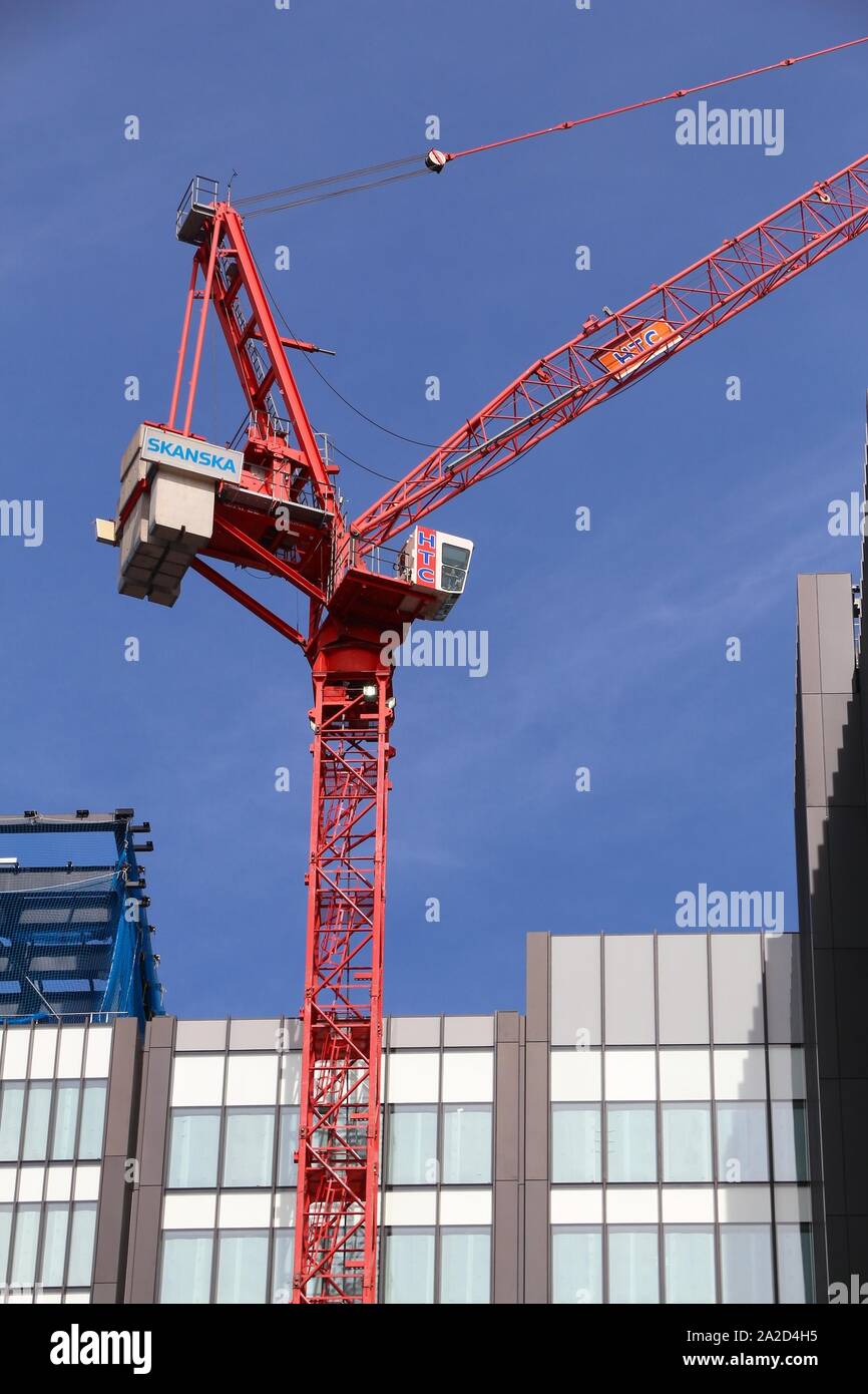 LONDON, UK - JULY 6, 2016: Skanska construction crane in London, UK. Skanska is a big multinational construction company based in Sweden. Stock Photo