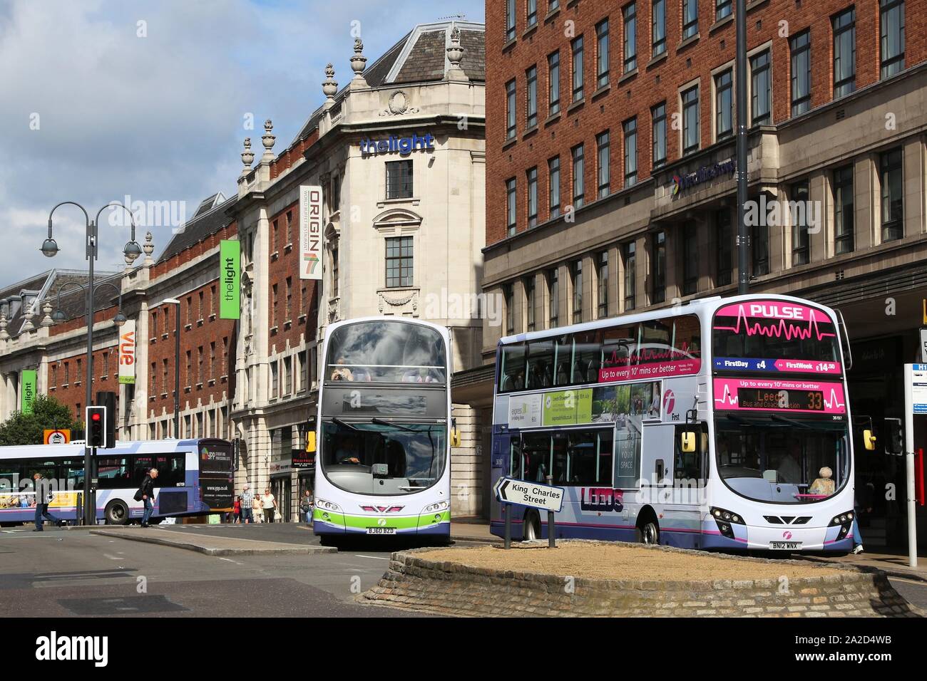 LEEDS, UK - JULY 12, 2016: People ride FirstGroup bus in Leeds, UK. FirstGroup employs 124,000 people. Stock Photo