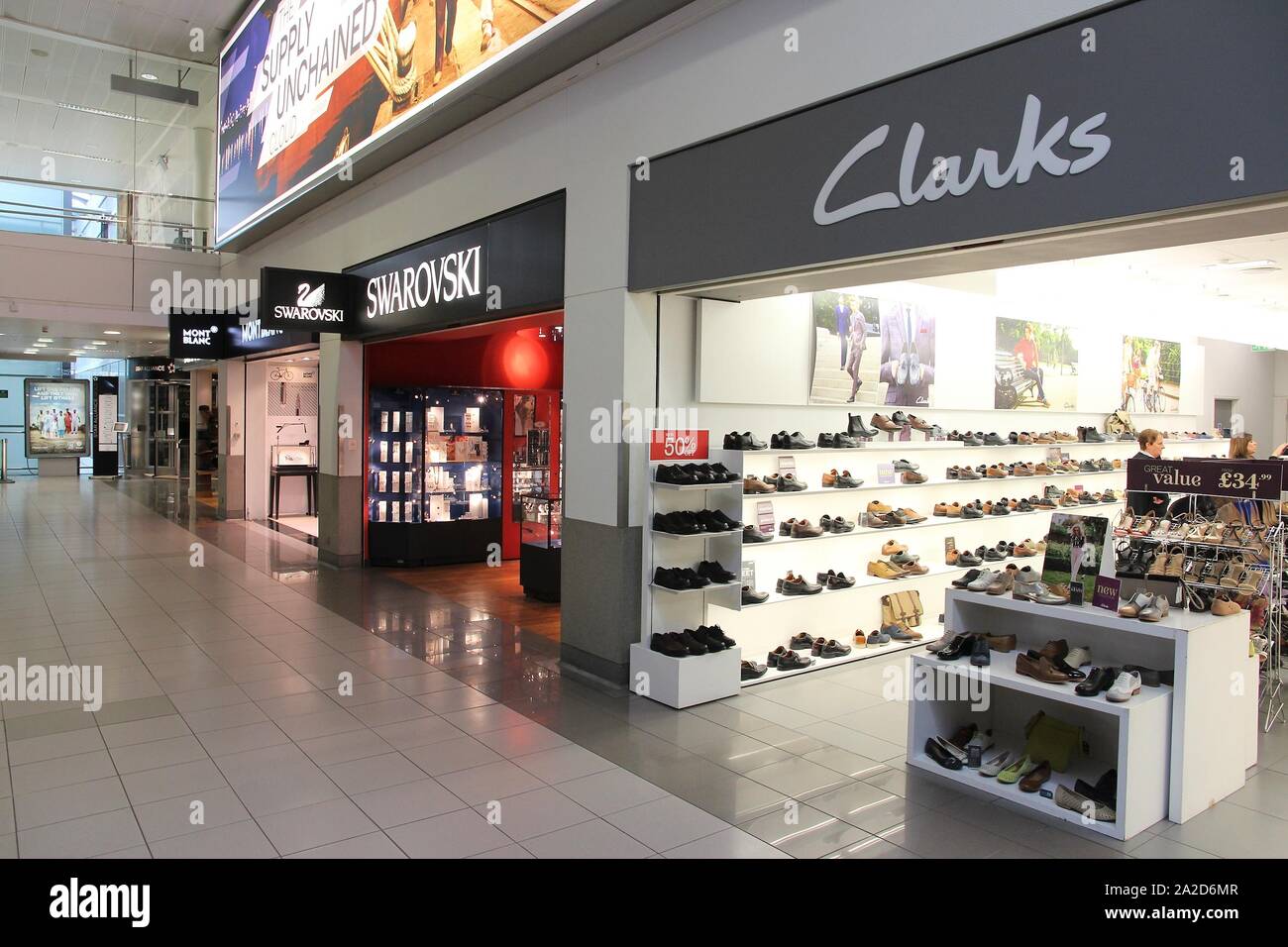LONDON, UK - APRIL 16, 2014: Mont Blanc, Swarovski and Clarks stores at  London Heathrow Airport, UK. Heathrow is the busiest airport in Europe. It  han Stock Photo - Alamy