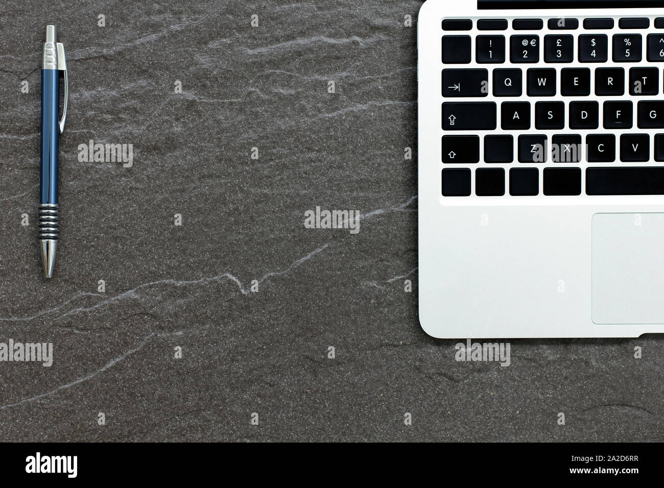 Laptop computer on a stone table with a modern look Stock Photo