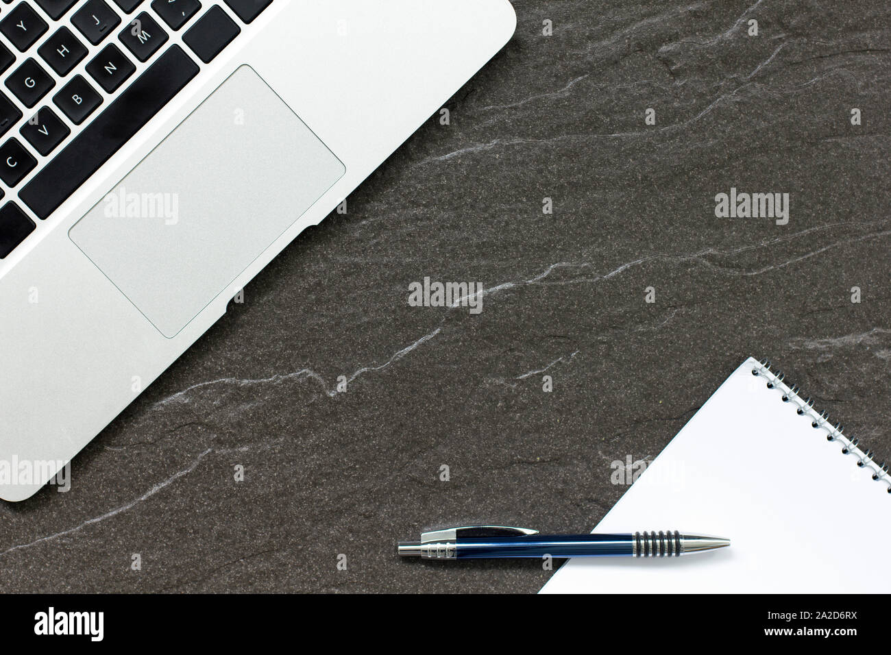 Laptop computer on a stone table with a modern look Stock Photo