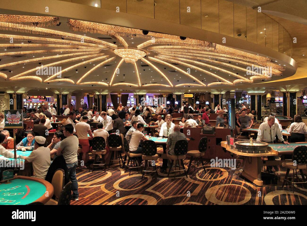 LAS VEGAS, USA - APRIL 14, 2014: People visit Caesar's Palace casino resort in Las Vegas. The famous casino resort has almost 4,000 rooms. Stock Photo