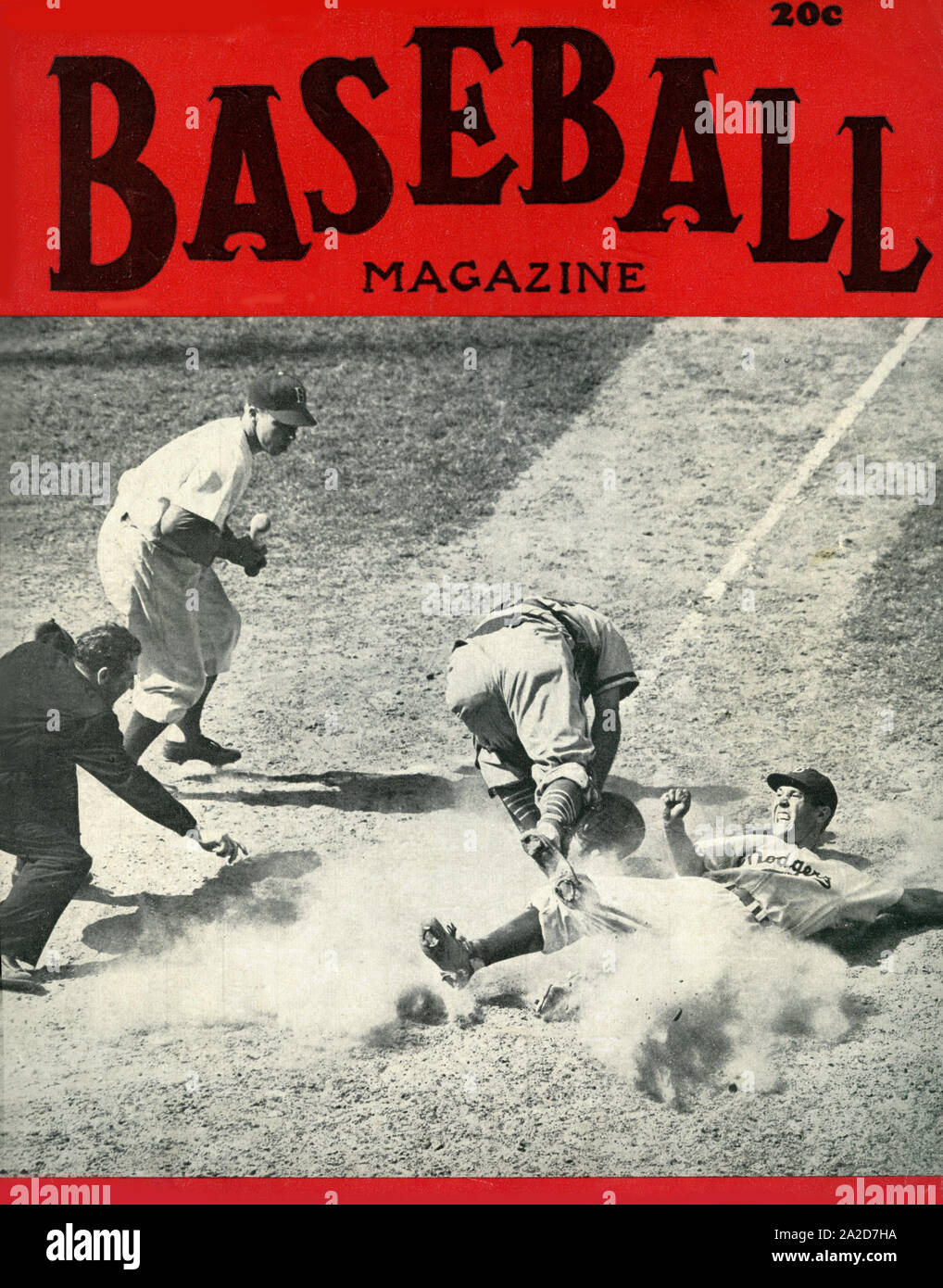 Vintage Baseball Magazine cover from the 1940s depicting Brooklyn Dodgers player Pete Reiser sliding into home plate on a close play. Stock Photo