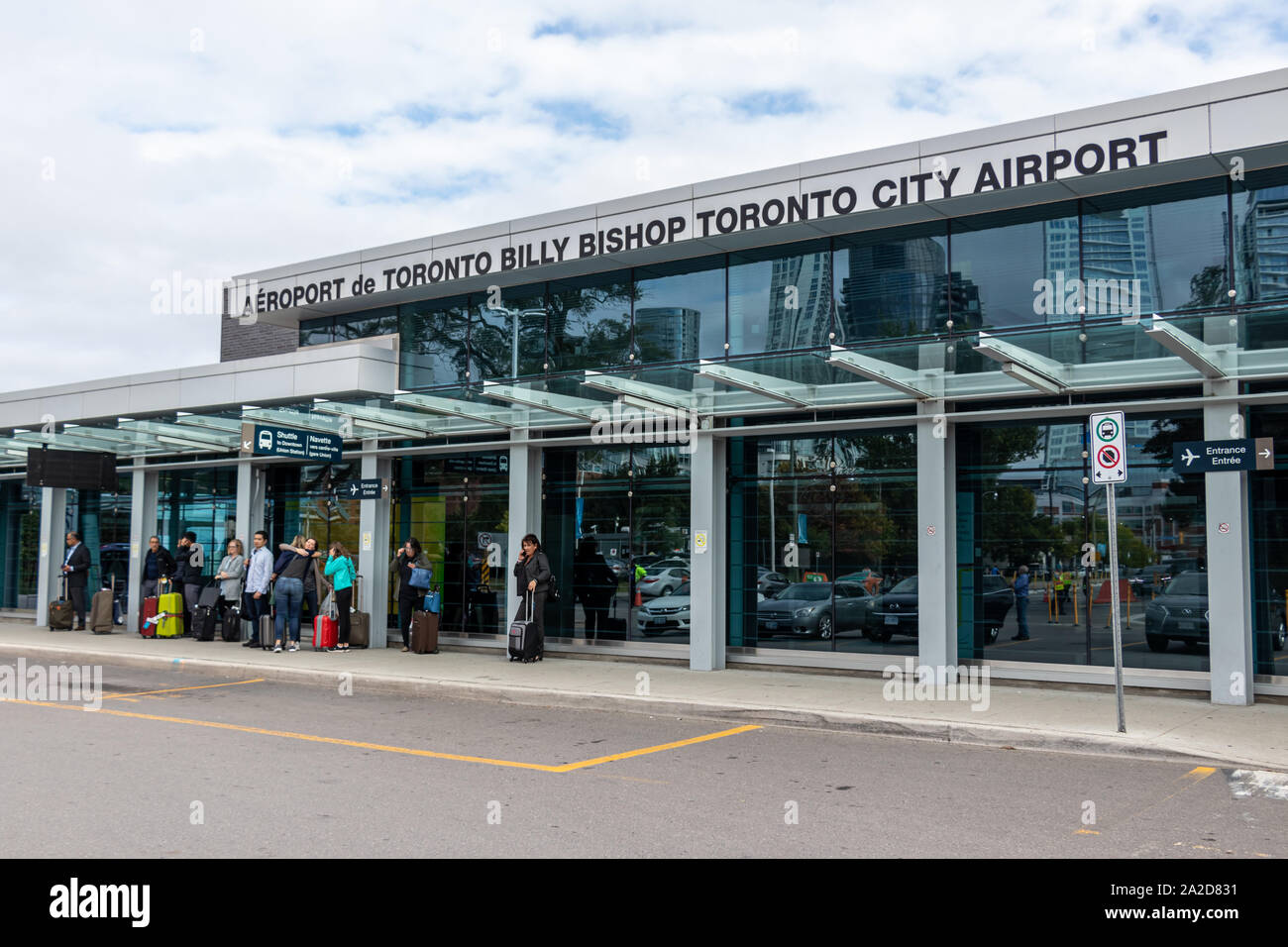 Passengers waiting out front of Billy Bishop Toronto City Airport at the mainland terminal in Toronto. Stock Photo