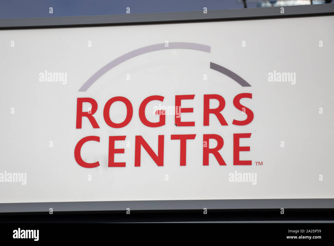 Rogers Centre logo on a sign in-front of famous stadium in downtown Toronto. Stock Photo