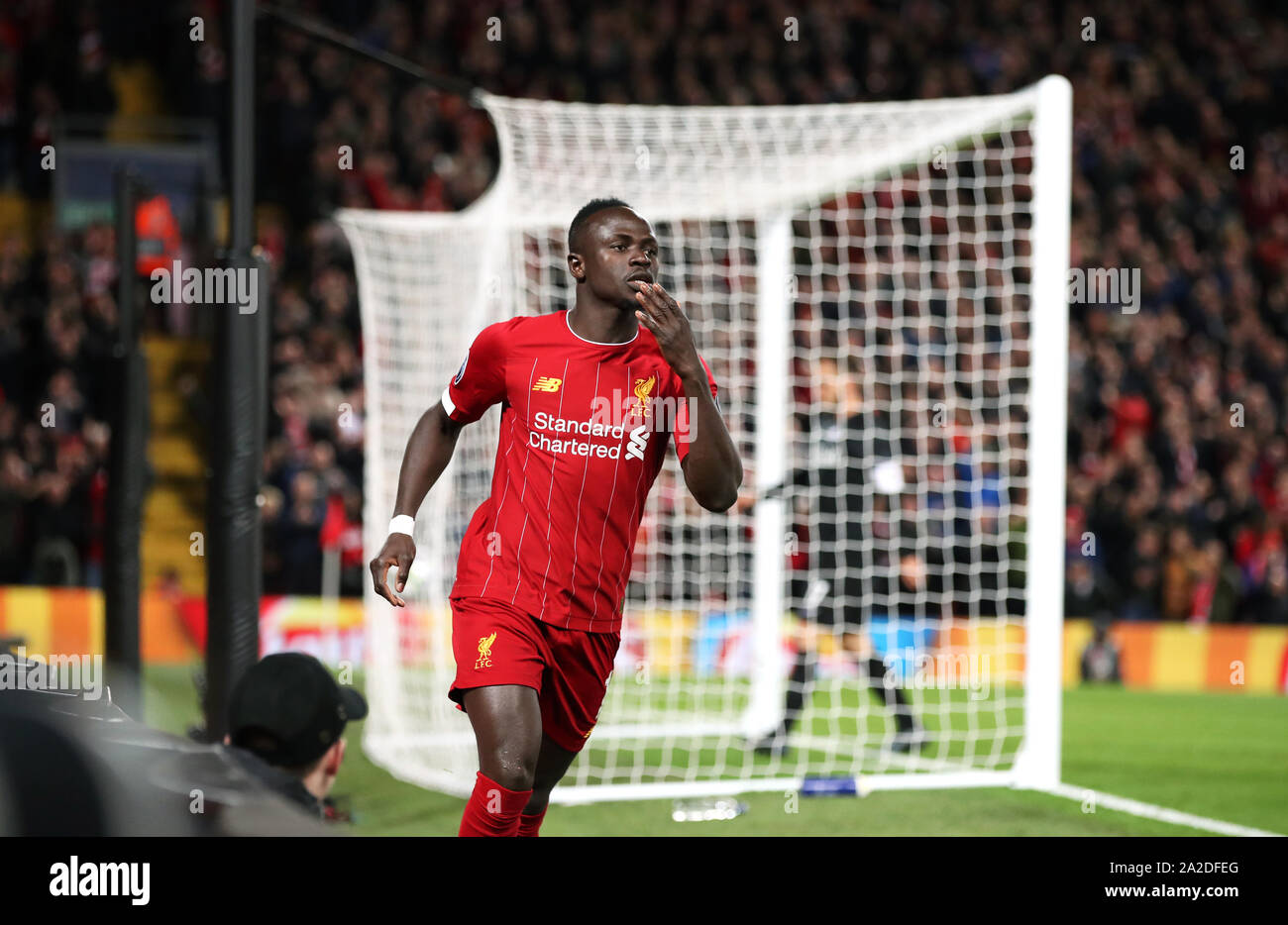 Liverpool's Sadio Mane celebrates scoring his side's first goal of the game during the UEFA Champions League Group E match at Anfield, Liverpool. Stock Photo