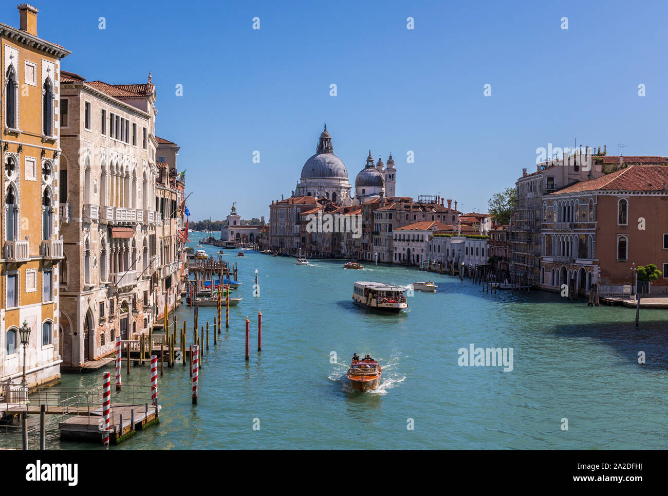 View of famous Canal Grande with Basilica di Santa Maria della Salute, Venice, Italy. View from Rialto Bridge Stock Photo