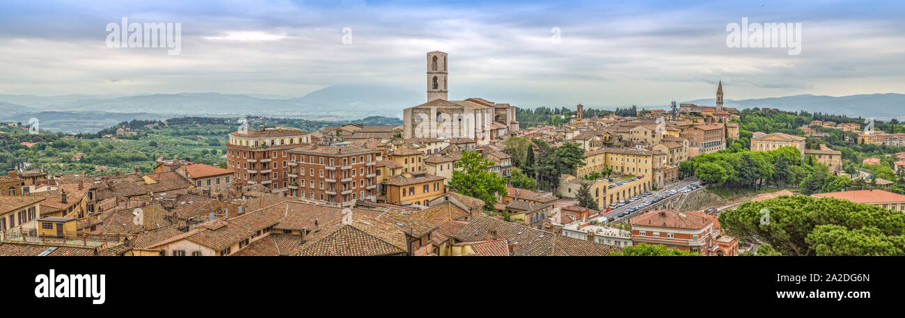 Perugia is a lively medieval walled hill town. Panoramic view of Perugia with basilica of San Domenico and with historic buildings, Umbria, Italy Stock Photo