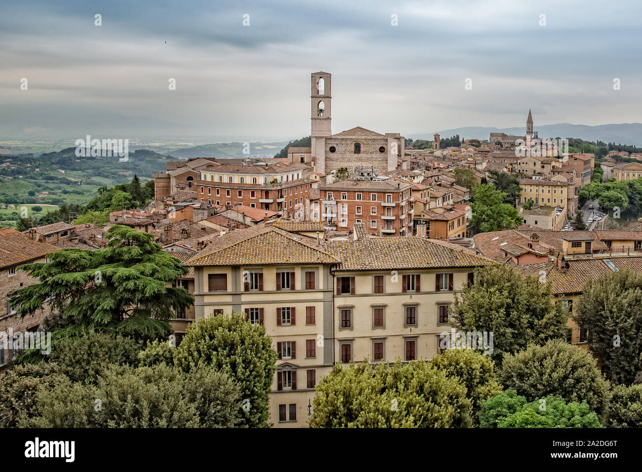 Perugia is a lively medieval walled hill town. View of the Basilica of San Domenico with medieval houses in Perugia historic quarter, Umbria, Italy Stock Photo