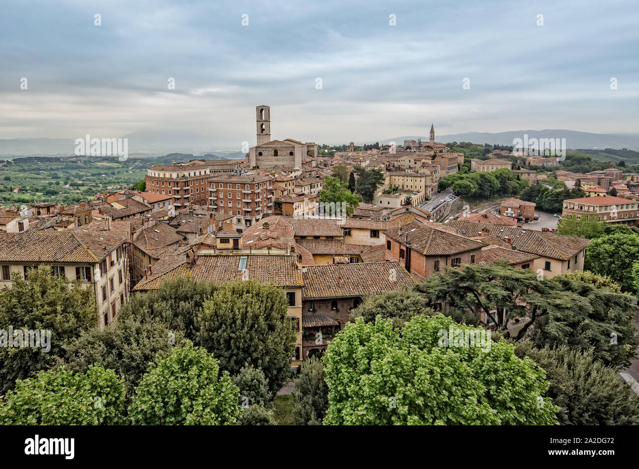 Perugia is a lively medieval walled hill town. View of the Basilica of San Domenico with medieval houses in Perugia historic quarter, Umbria, Italy Stock Photo