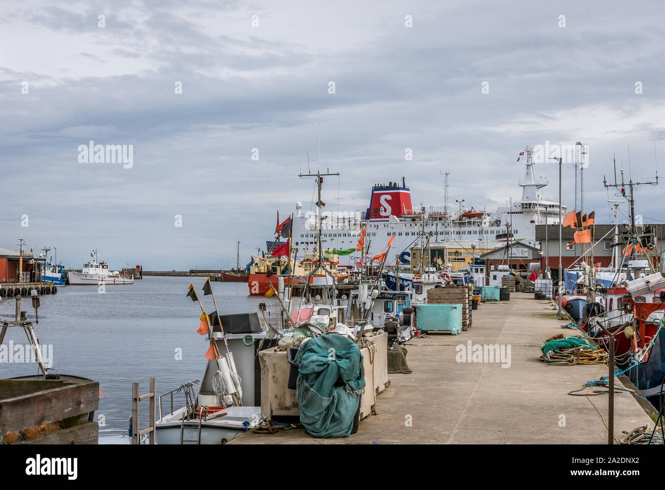 The car ferry Stena Nautika and fishing boats, nets at the jetty of Grenaa, Denmark, September 6, 2019 Stock Photo