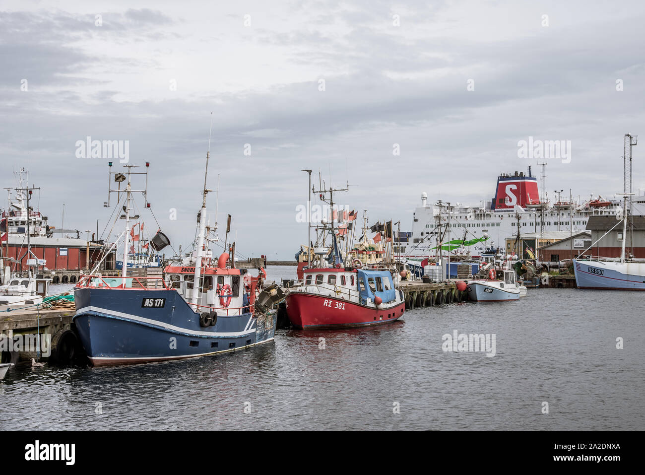The car ferry Stena Nautika and fishing boats at the pier of Grenaa, Denmark, September 6, 2019 Stock Photo
