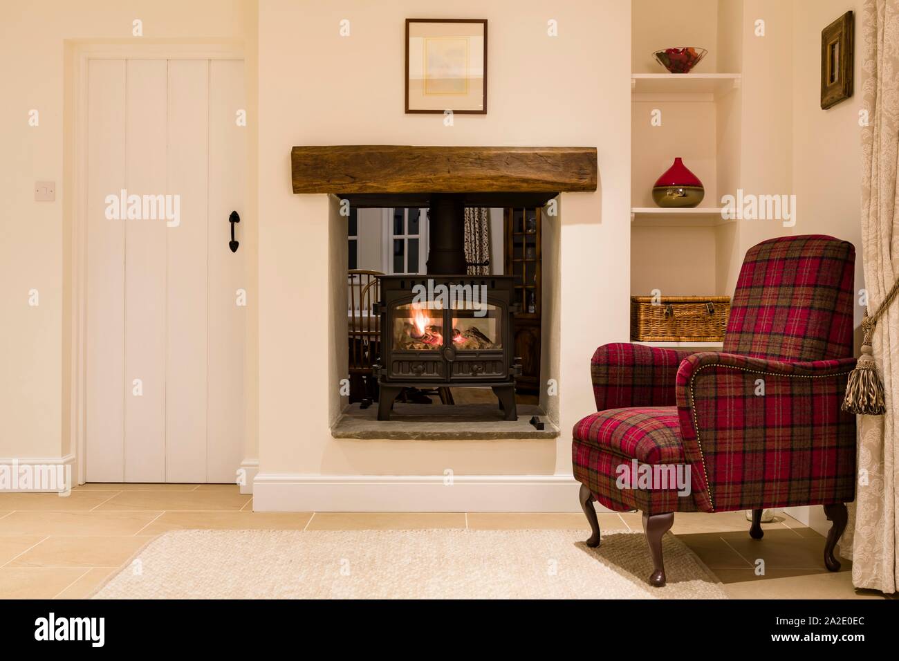 Living room interior with a wood burning stove, UK Stock Photo