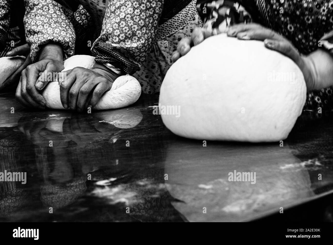 Women hands making bread Stock Photo