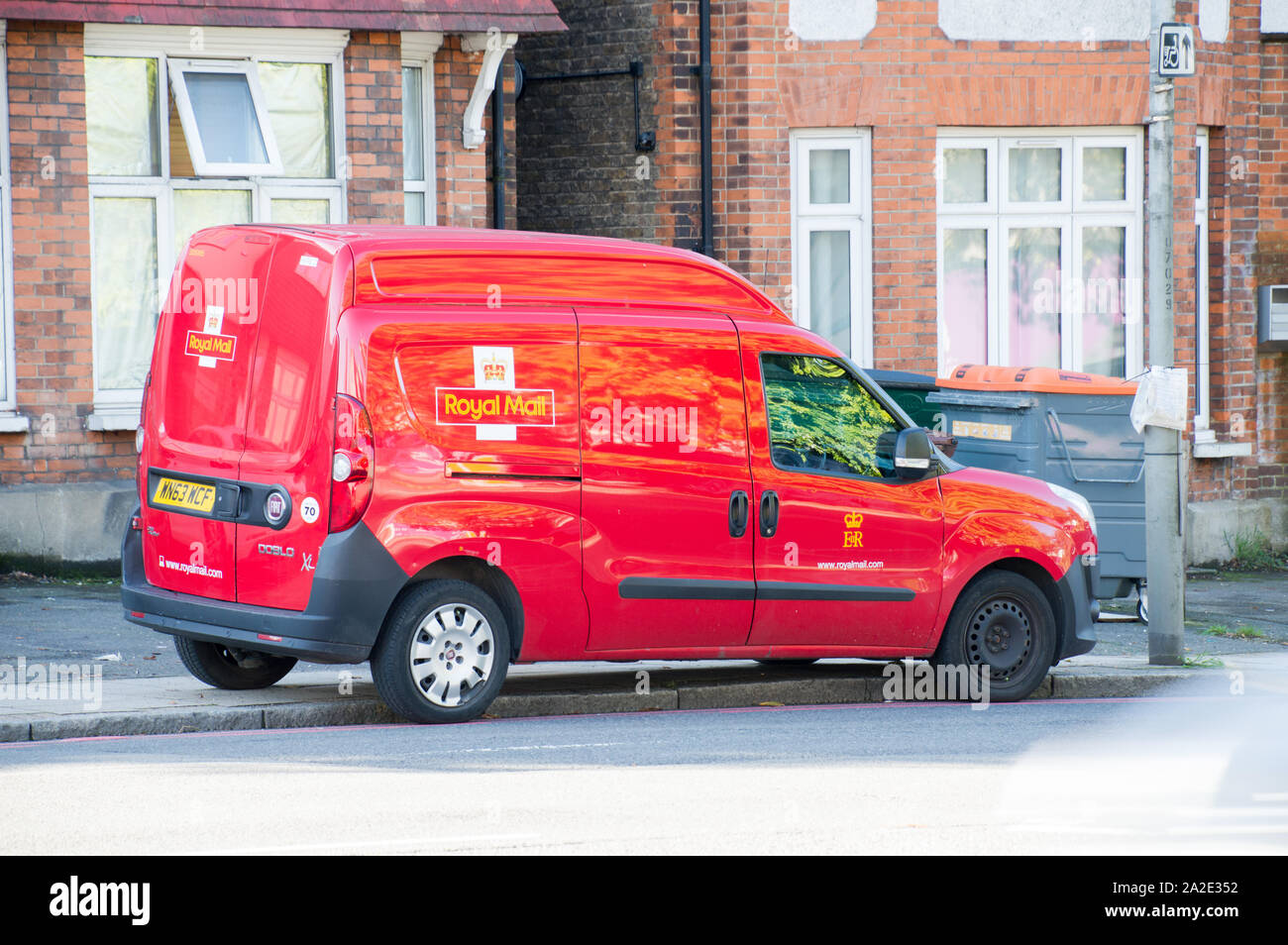 Royal mail red fiat doblo van parked in a residential area on platform Stock Photo