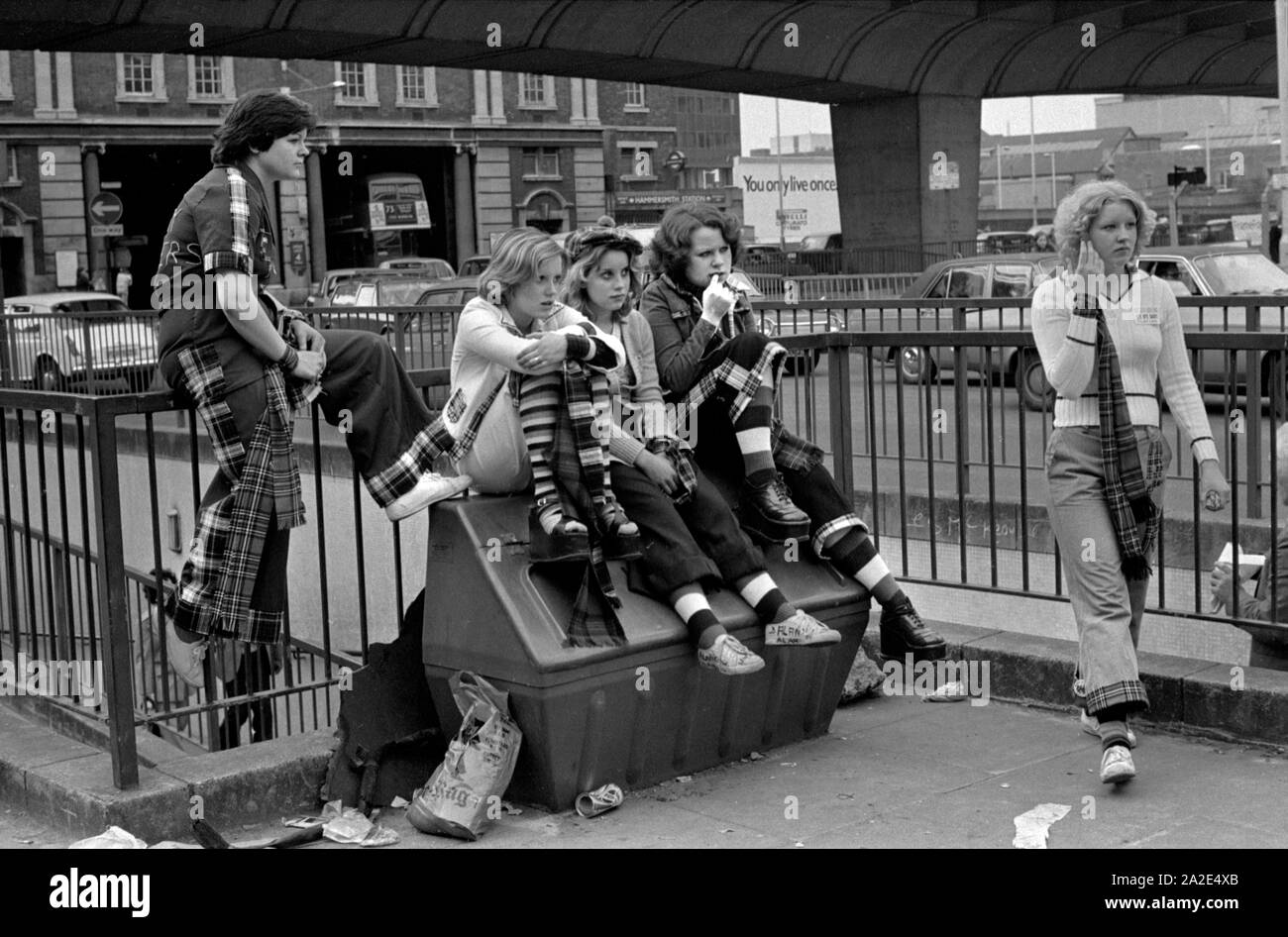1970s UK Teenage girl Bay City Roller Fans. Boy band pop group leave pop concert at Hammersmith Odeon, west London 1975. Girls are wearing the Bay City Roller tartan fashion 70s HOMER SYKES Stock Photo