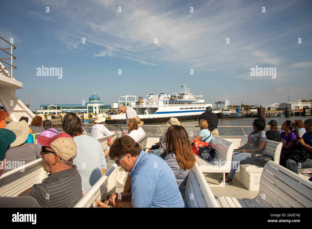 Cape May, New Jersey - September 28, 2019 :   Sightseeing cruise boat passing the Cape May - Lewes Ferry terminal along Delaware Bay. Stock Photo