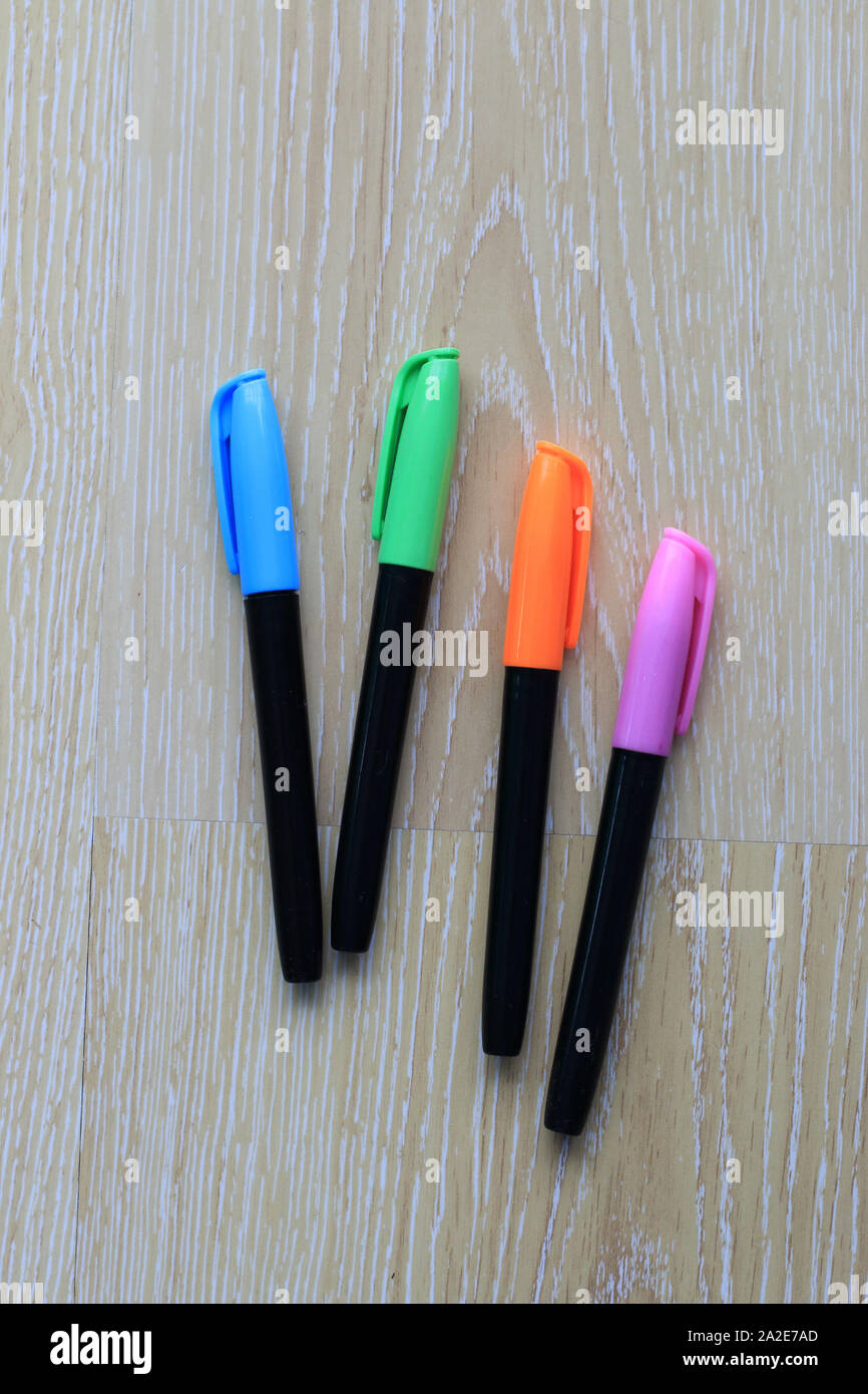 Set of coloured marker pens on wooden background Stock Photo