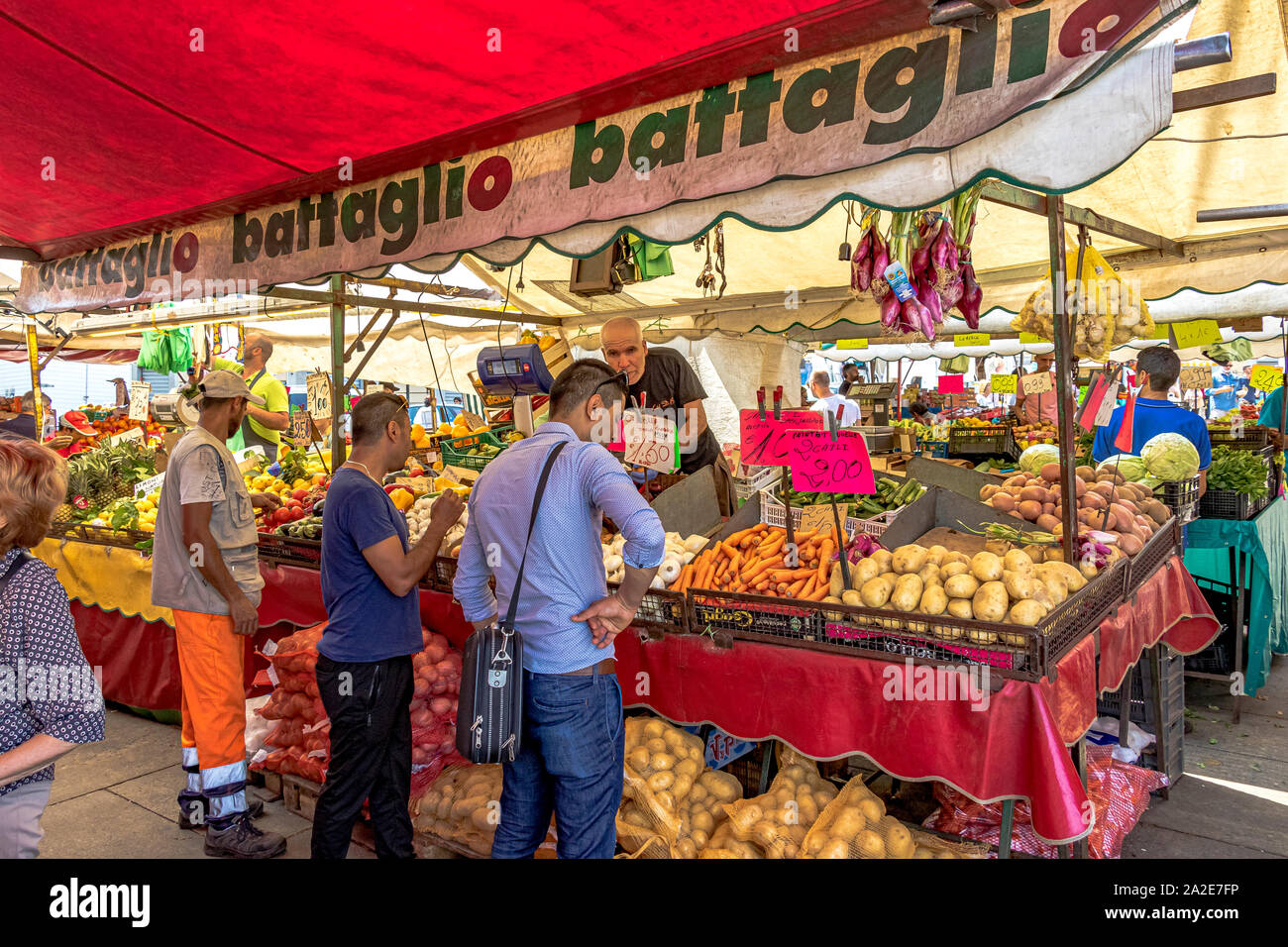 People shopping at Mercato di Porta Palazzo ,one of the largest open air markets in Europe selling a huge variety of fresh produce ,Turin ,Italy Stock Photo