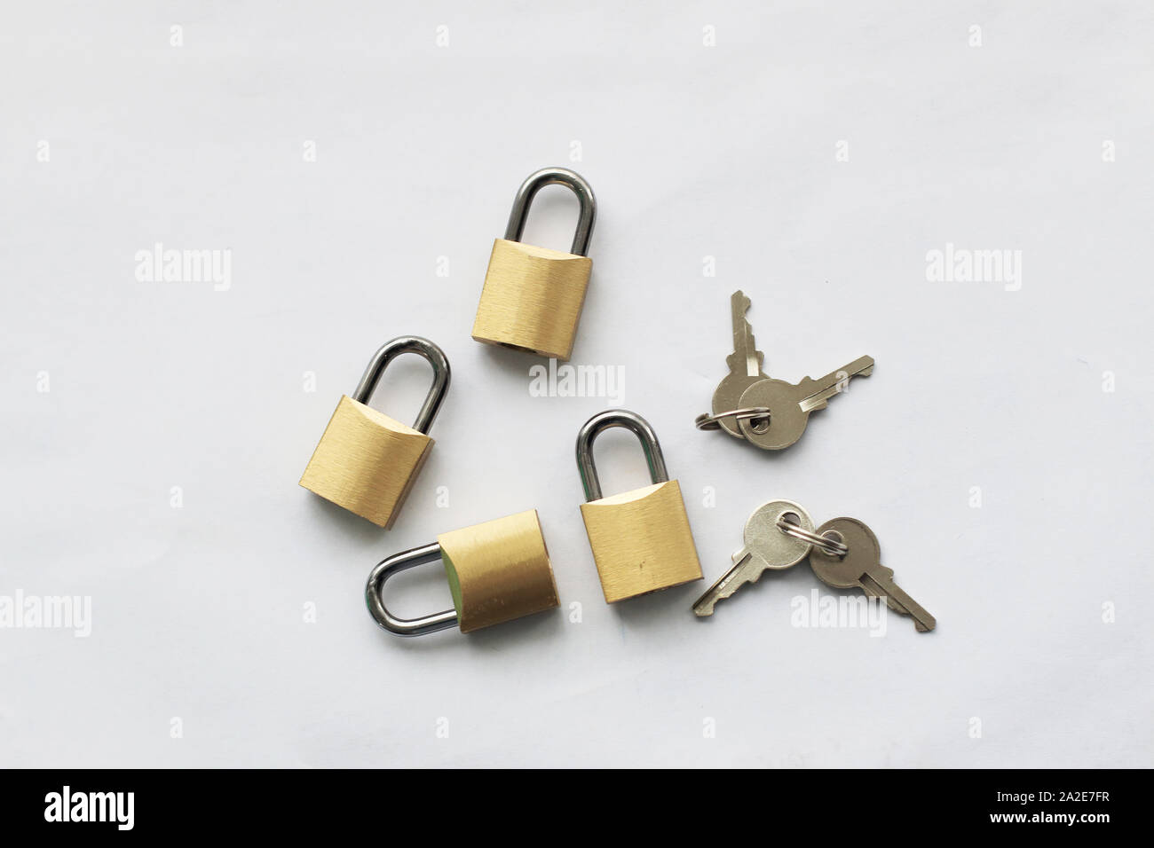 Keys and padlocks isolated against white background Stock Photo