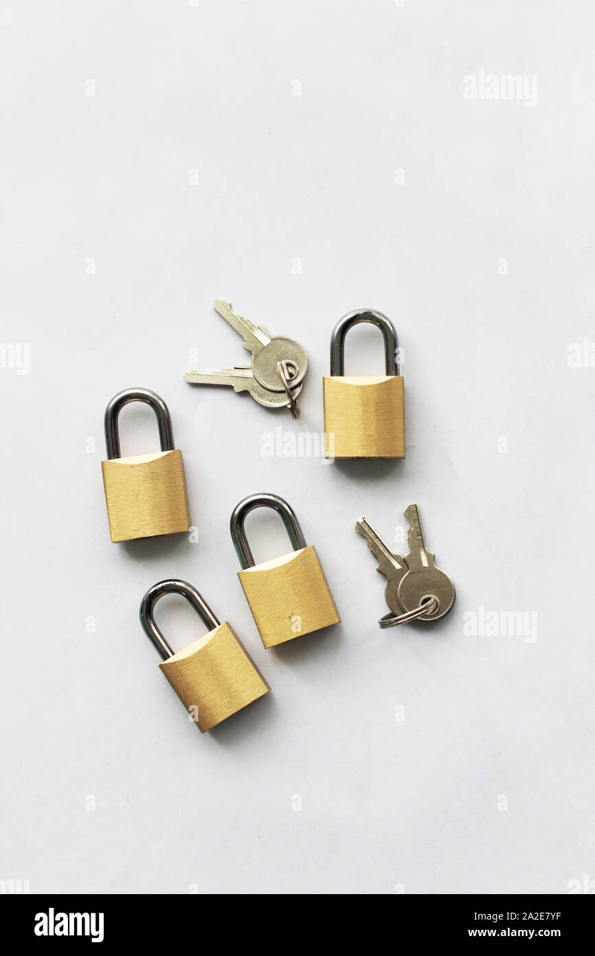 Keys and padlocks isolated against white background Stock Photo