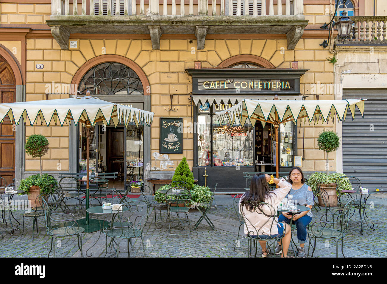 People drinking coffee outside Café Al Bicerin  an 18th century coffee shop deep in the heart of Turin in Piazza della Consola ,Turin ,Italy Stock Photo