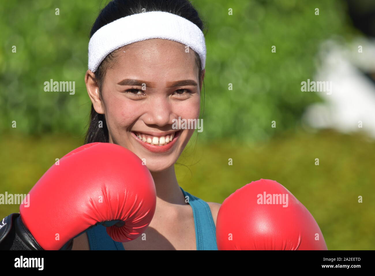 A Smiling Athletic Minority Female Boxer Stock Photo