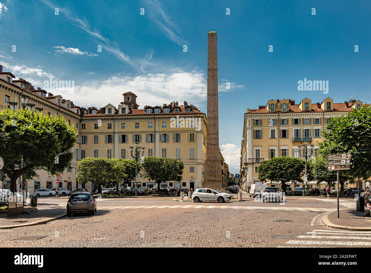 Elegant buildings surrounding Piazza Savoia in hte centre of which is Obelisco alle Leggi Siccardi ,Turin ,Italy Stock Photo