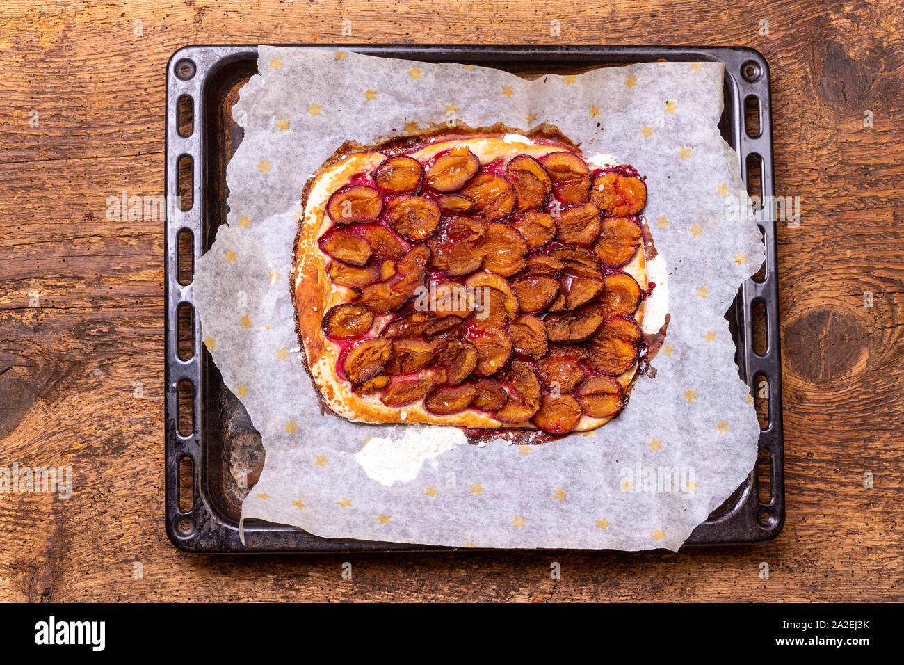 bavarian plum pie on dark wood Stock Photo