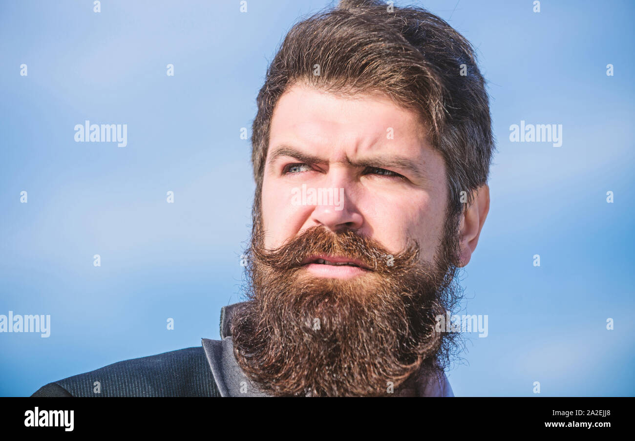 Every beard completely unique. Invest in stylish appearance. Grow thick beard fast. Man bearded hipster wear formal suit blue sky background. Facial hair beard and mustache care. Beard fashion trend Stock Photo - Every beard completely unique. Invest in stylish appearance. Grow thick beard fast. Man bearded hipster wear formal suit blue sky background. Facial hair beard and mustache care. Beard fashion trend Stock Photo -