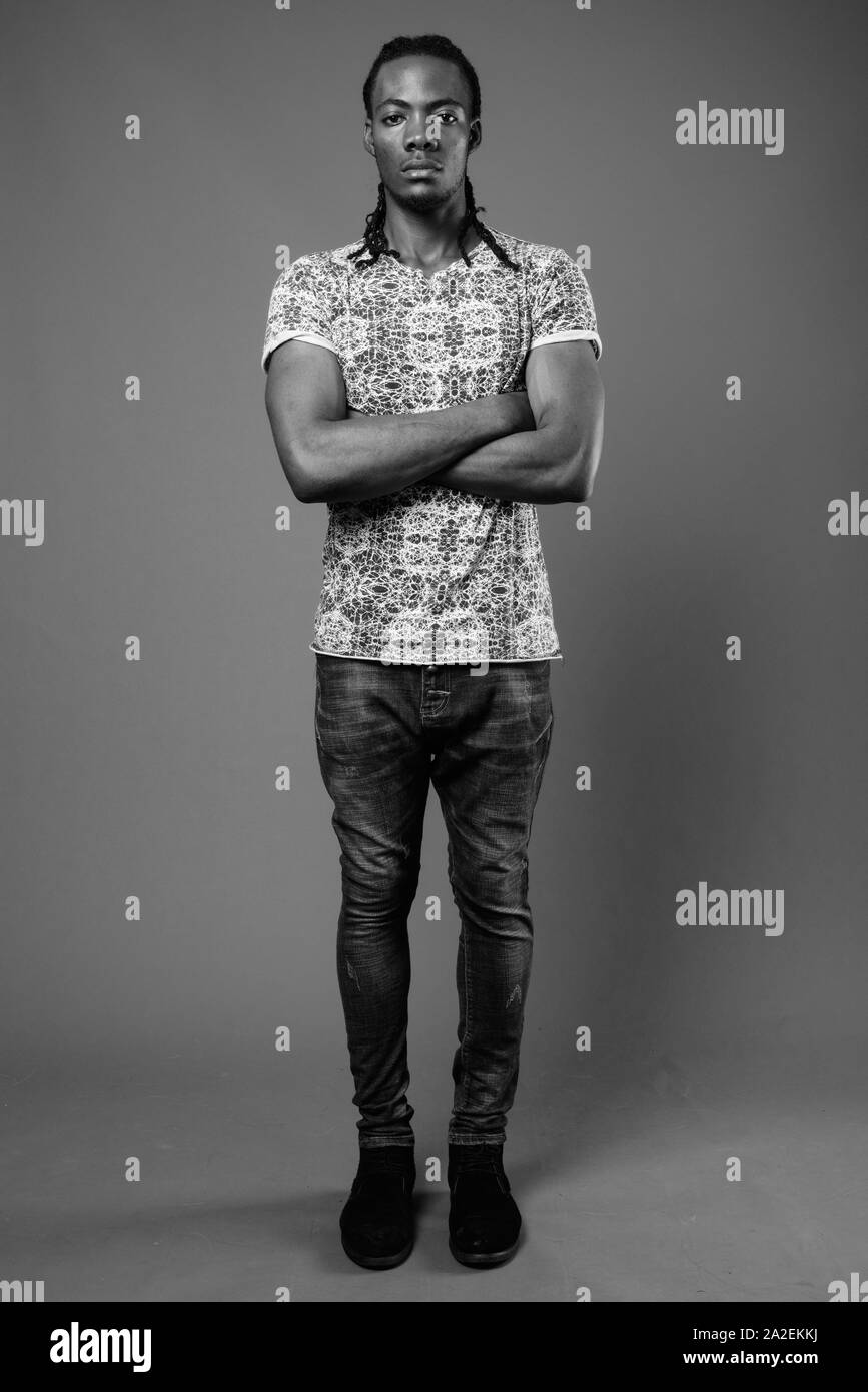 Portrait handsome african guy arms Black and White Stock Photos ...
