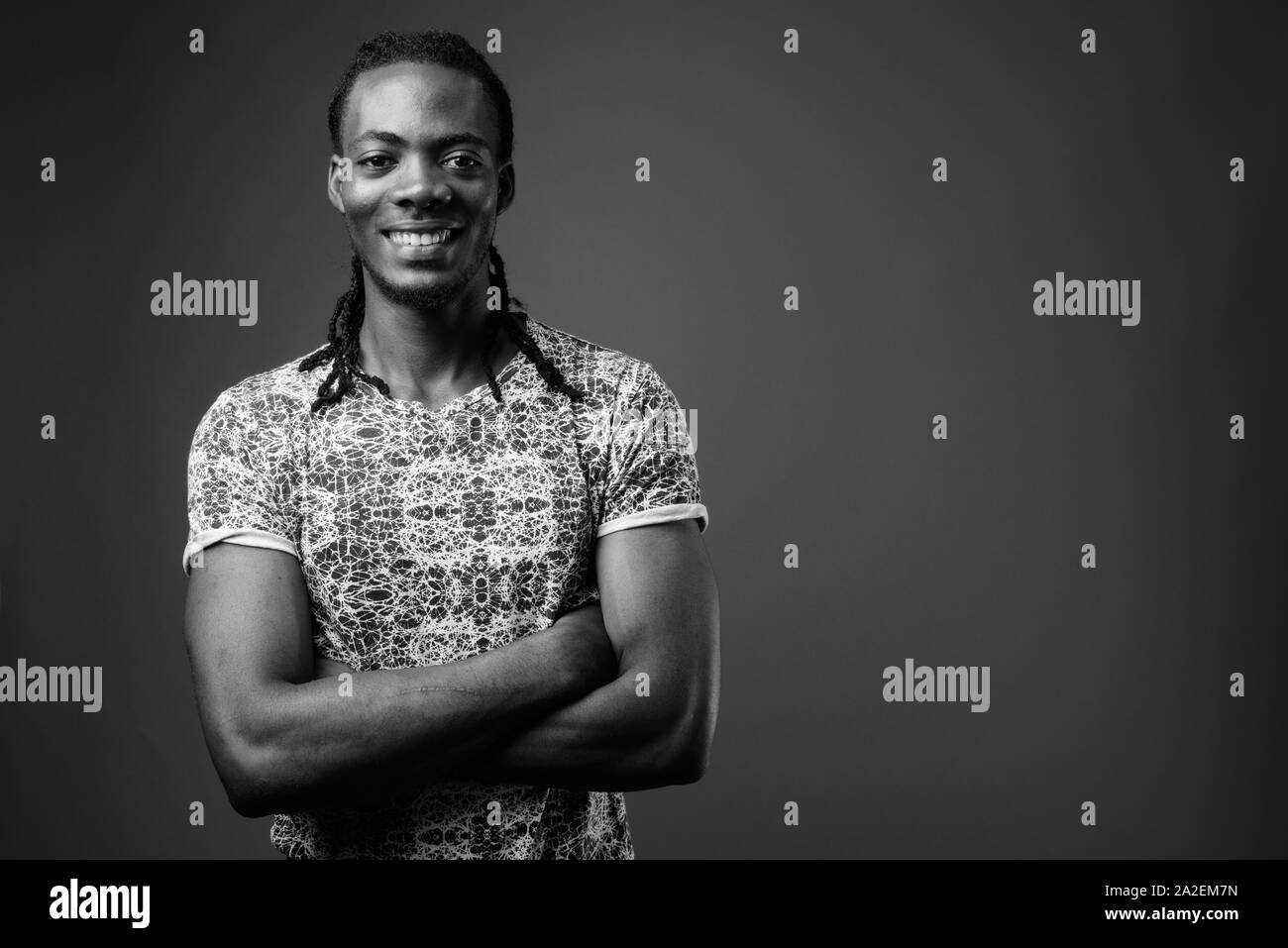 Portrait handsome african guy arms Black and White Stock Photos ...